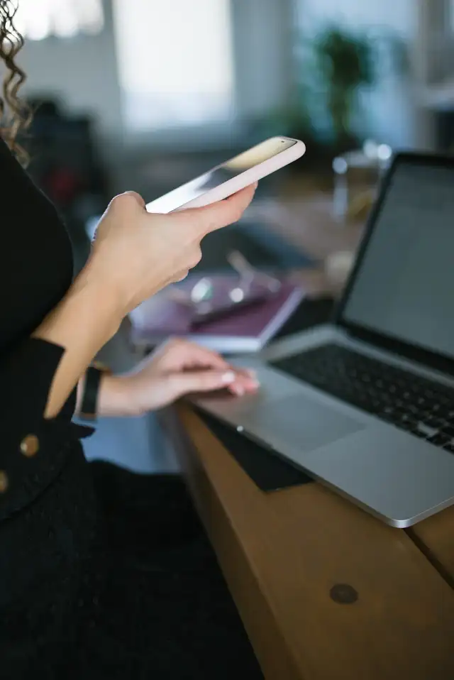 Close up of woman using mobile smart phone and sending messages