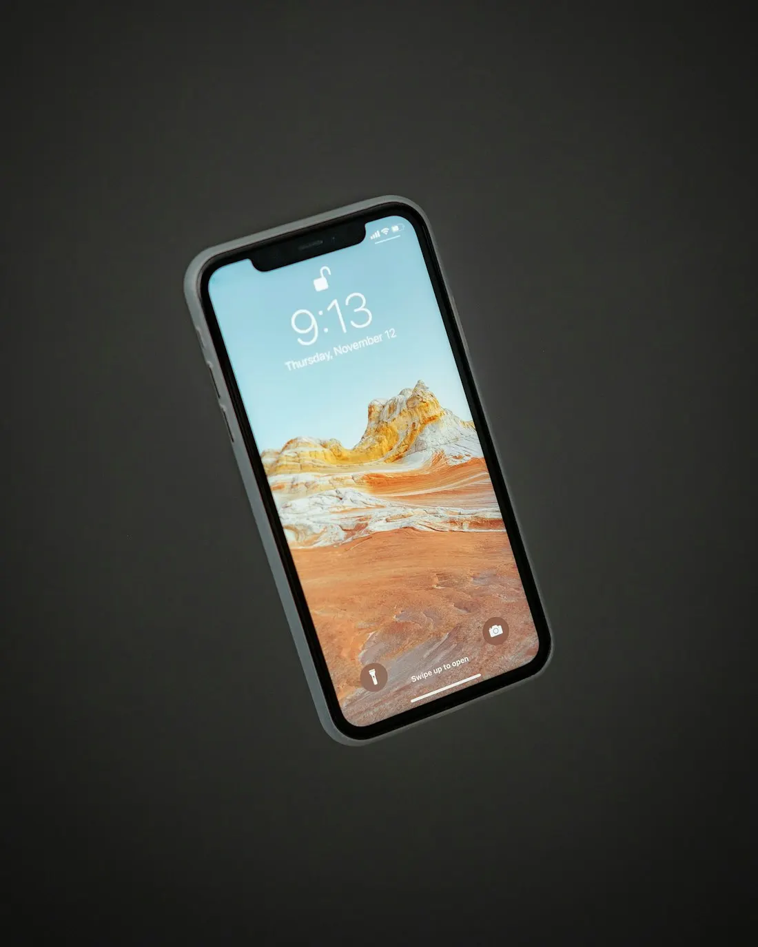 A smartphone against a dark background