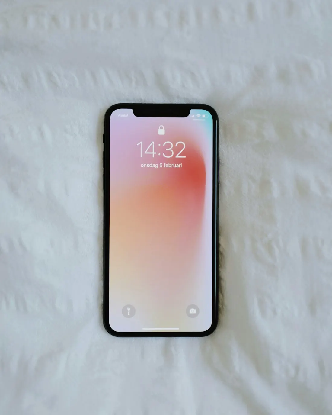 A smartphone on a light colored surface