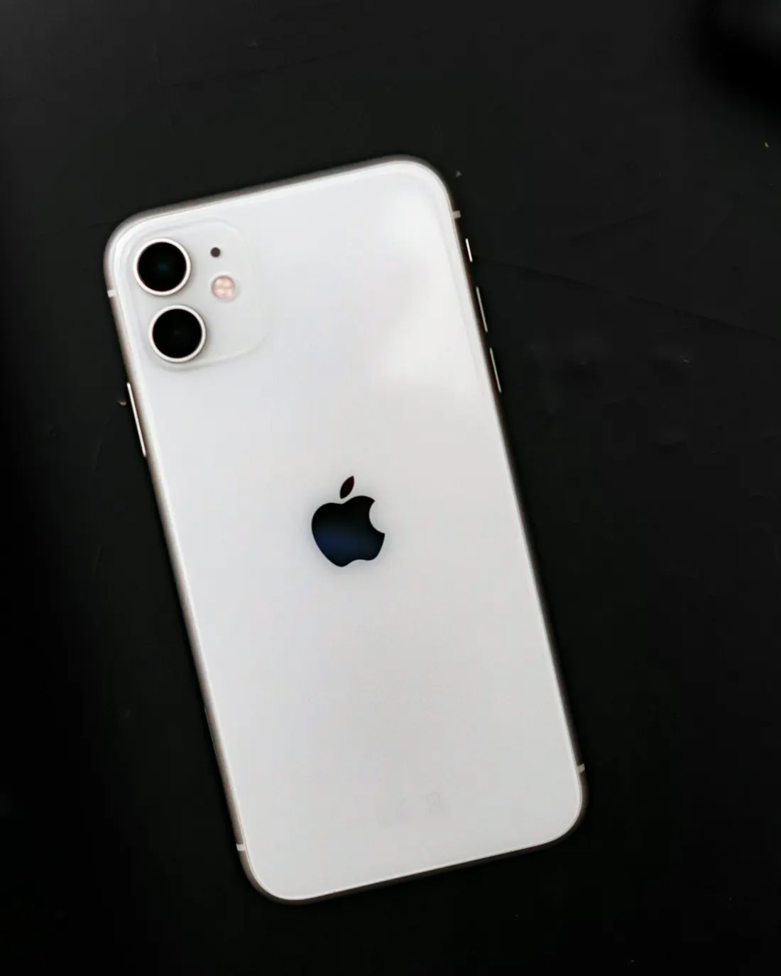 The back of a white smartphone