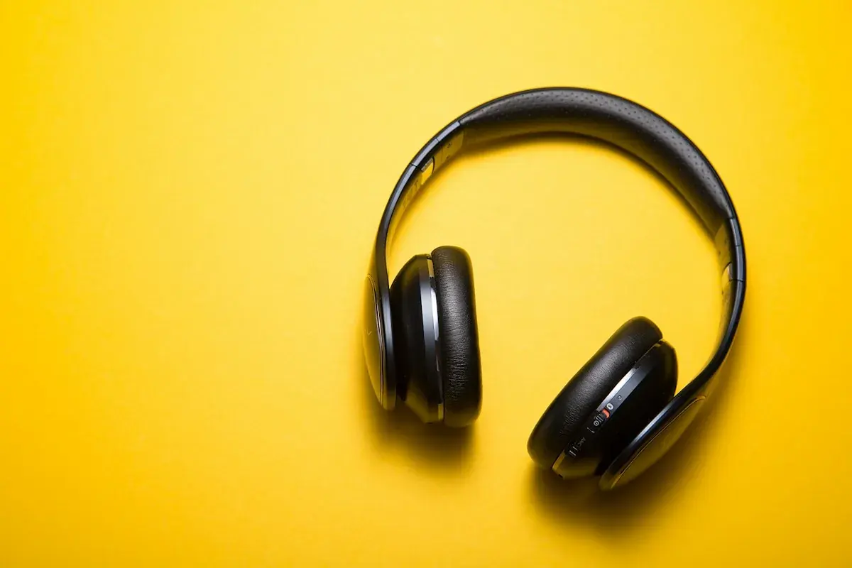 Over ear headphones on a yellow background