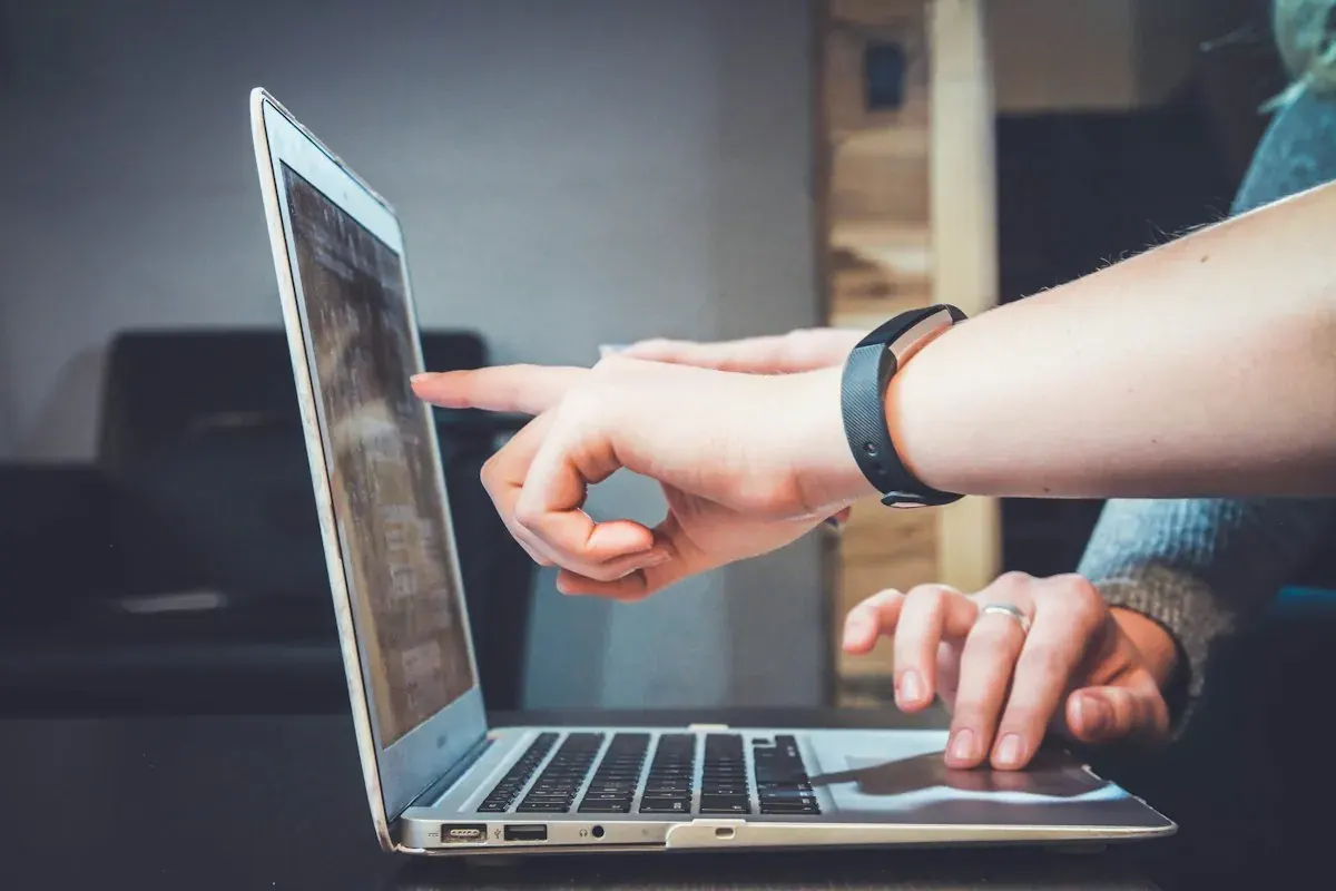 People collaborating around a computer