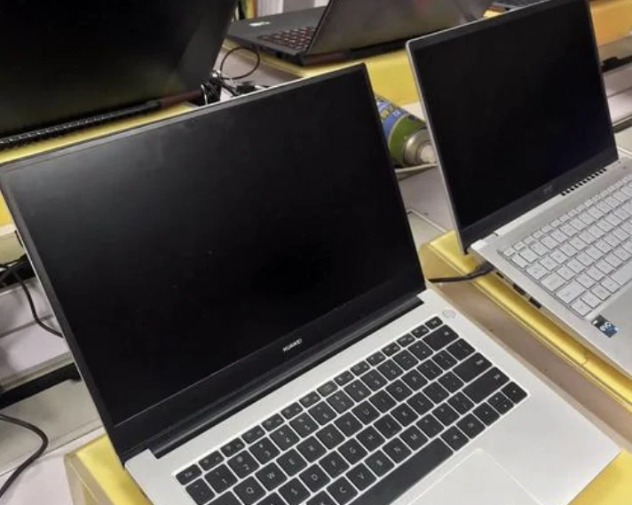 Several laptops on display for comparison and inspection