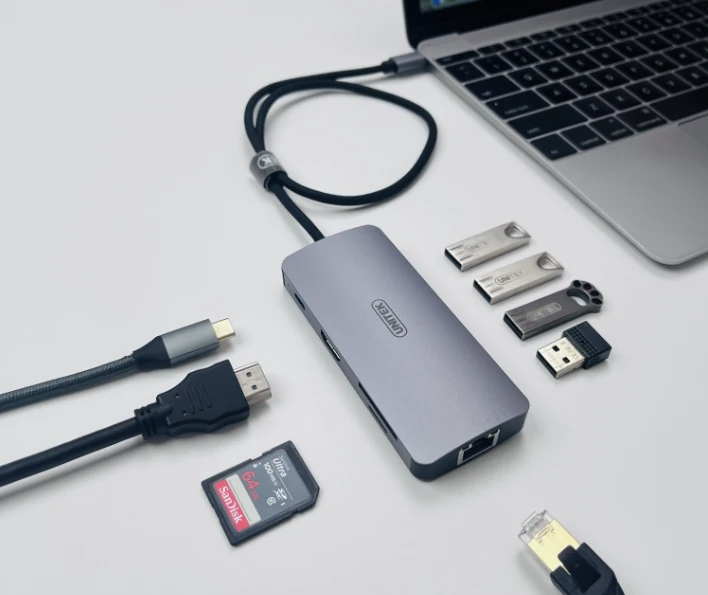 A USB docking hub with display cables and removable storage