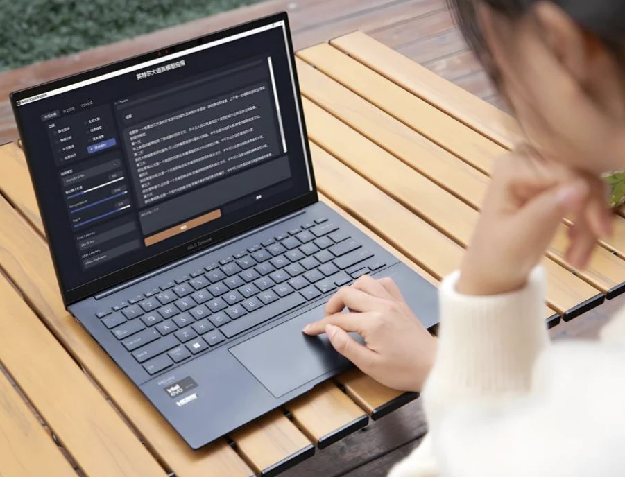 A person using an AI writing application on a laptop