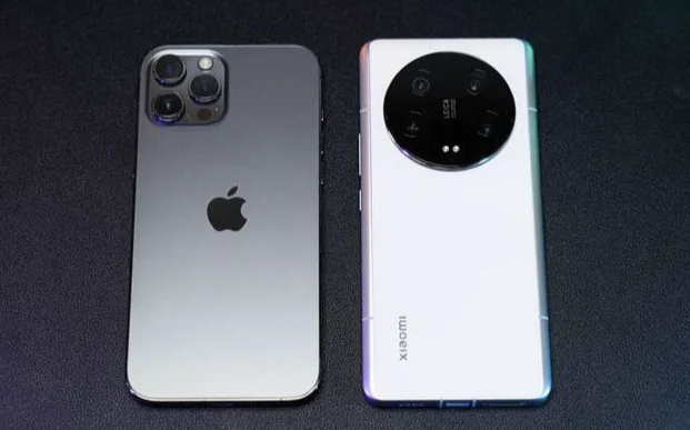 The rear panels of two smartphones placed side by side