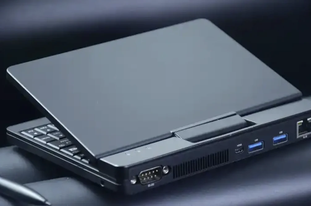 A laptop showing its rear display and USB connectors