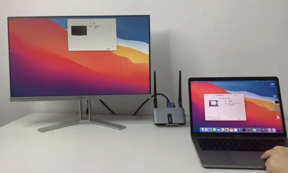 A laptop connected to an external monitor on a desk